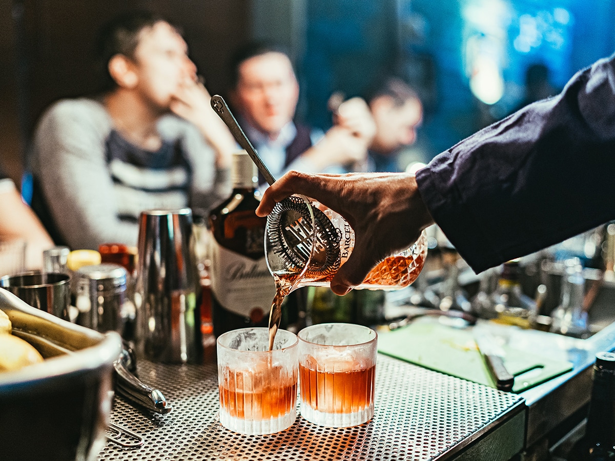 Bartender pouring a cocktail | Image: Stanislav Ivanitskiy