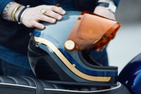 Motorcycle helmet in a man's hand