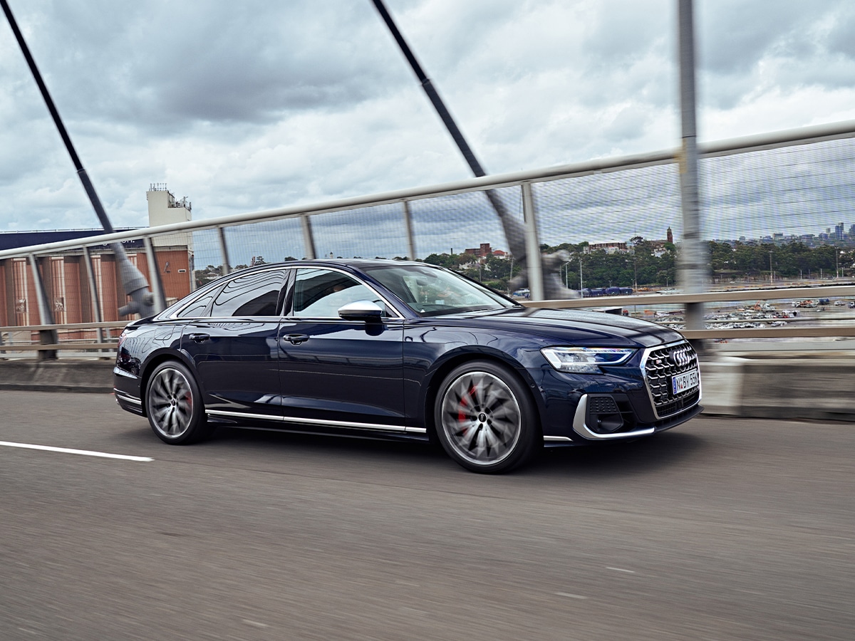 2023 audi s8 driving on road from front