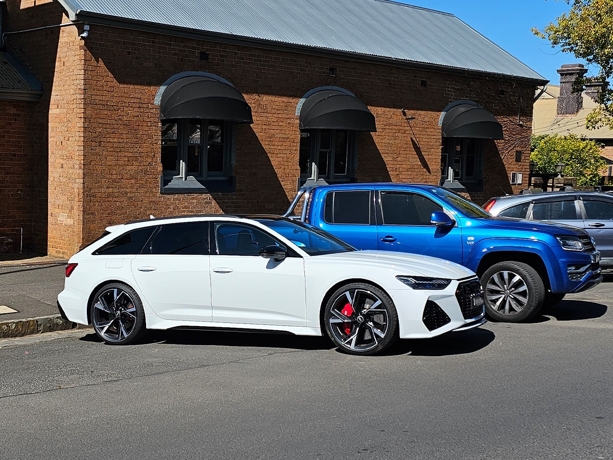 Audi rs 6 next to ute