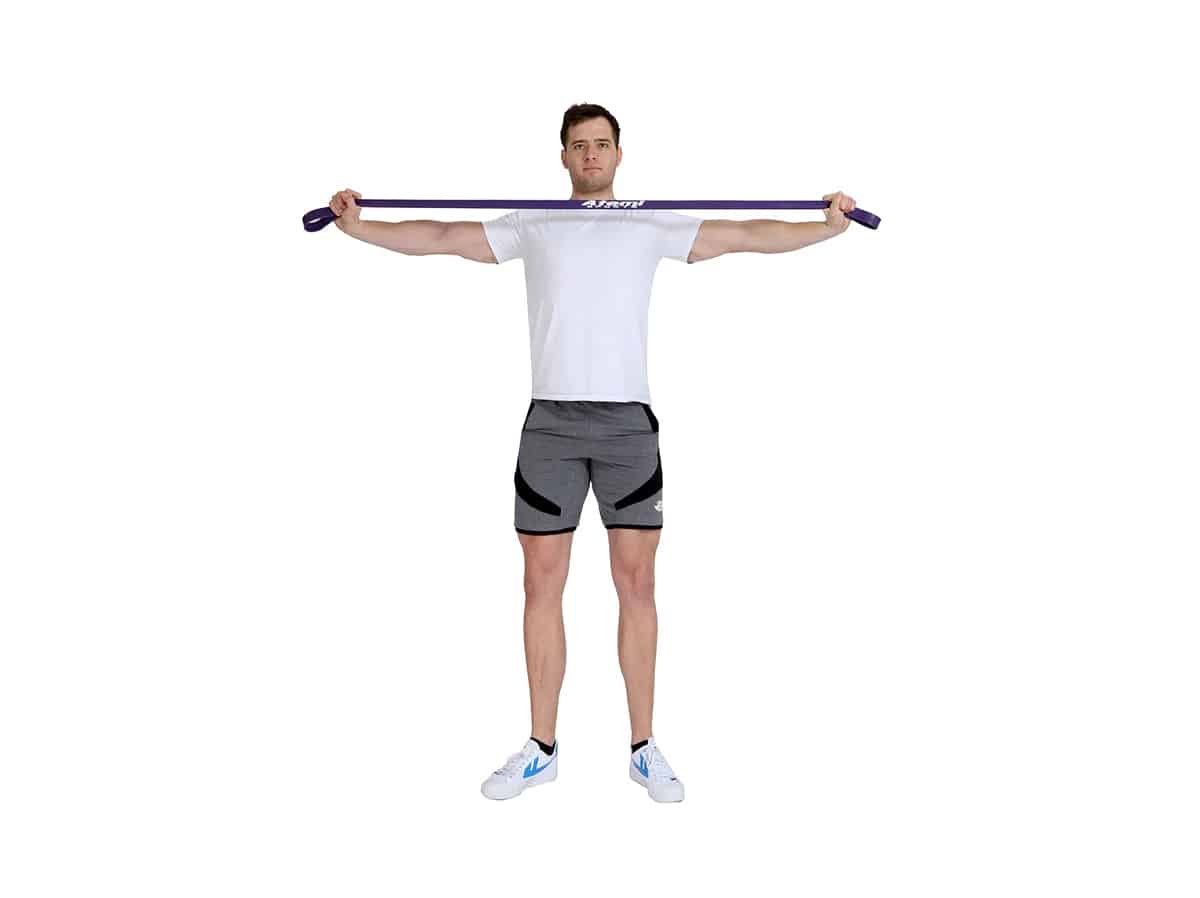 Man doing resistance band pull-apart exercise