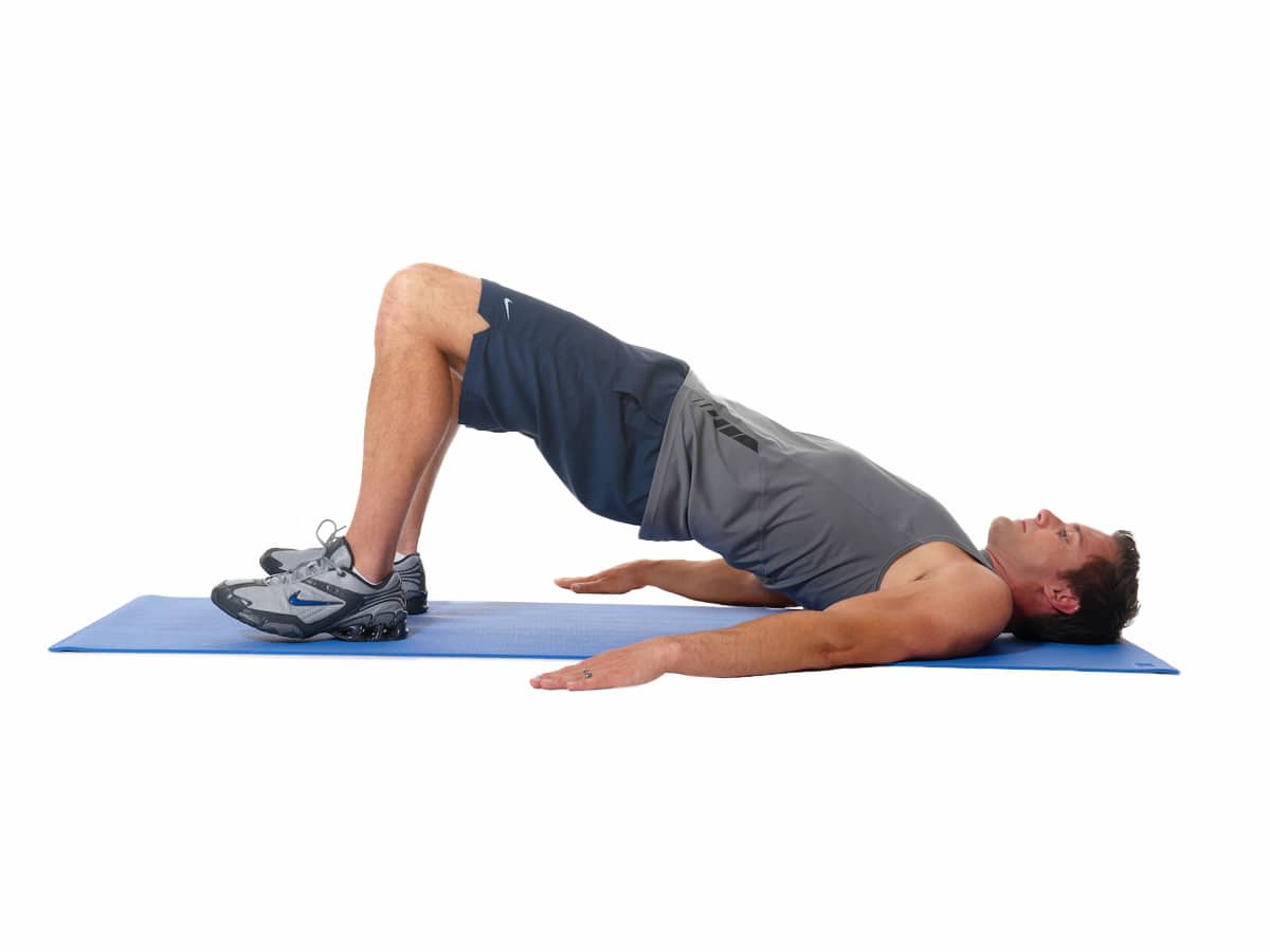 Man doing a Hip Bridge core exercise