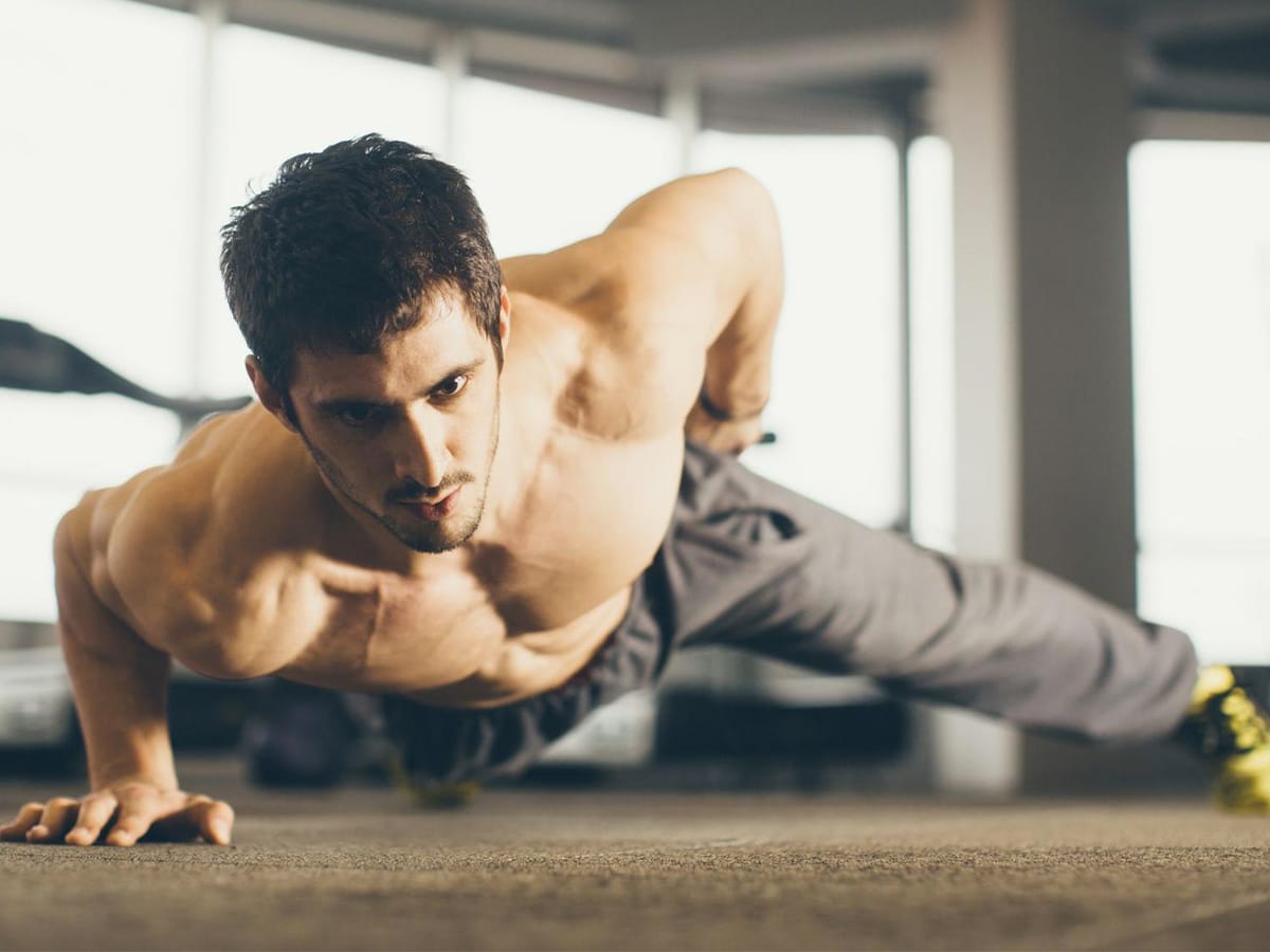 Man doing one arm push up