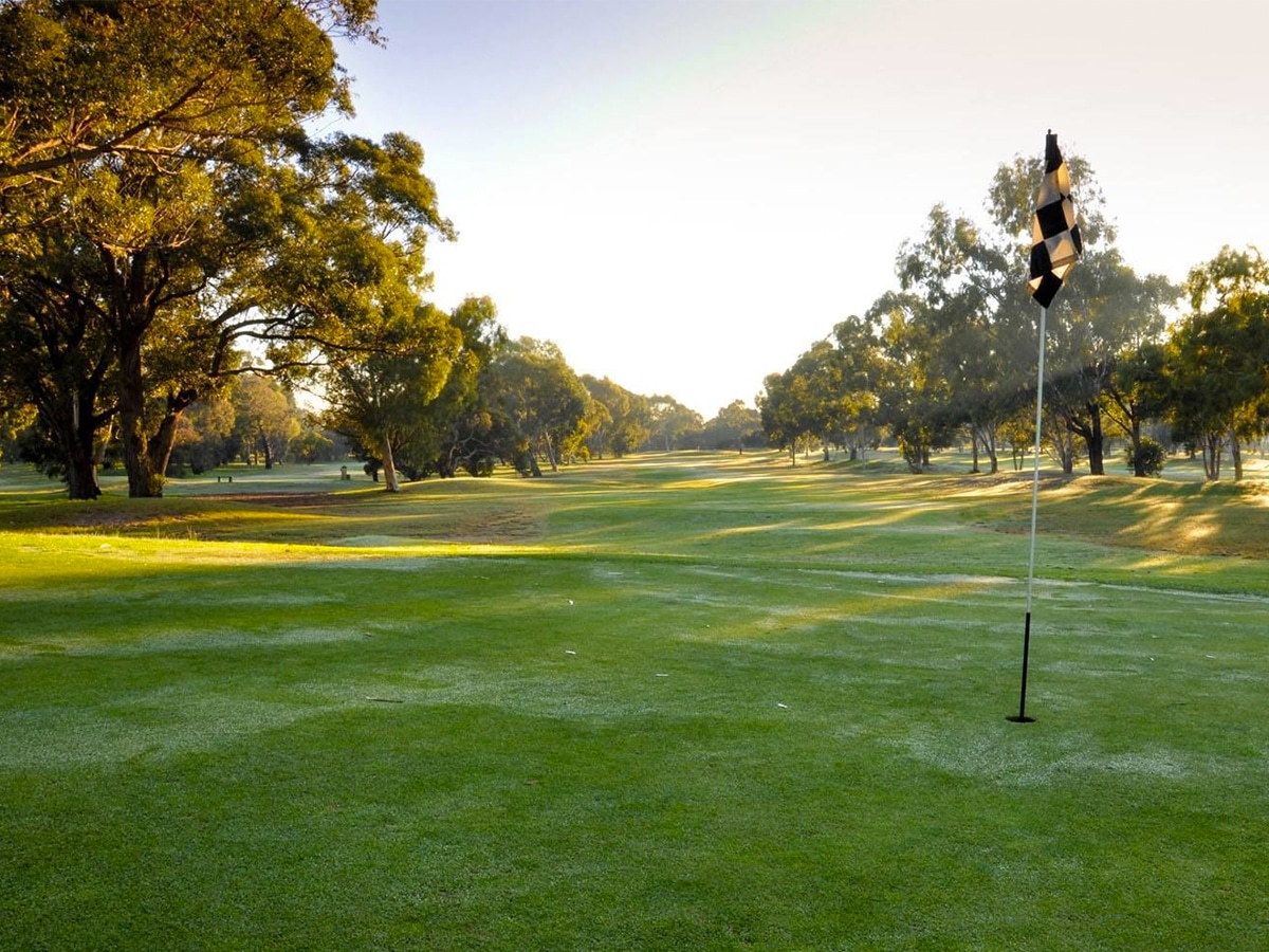 Full shot of Hillview Golf Course showing a flagstick on the right side