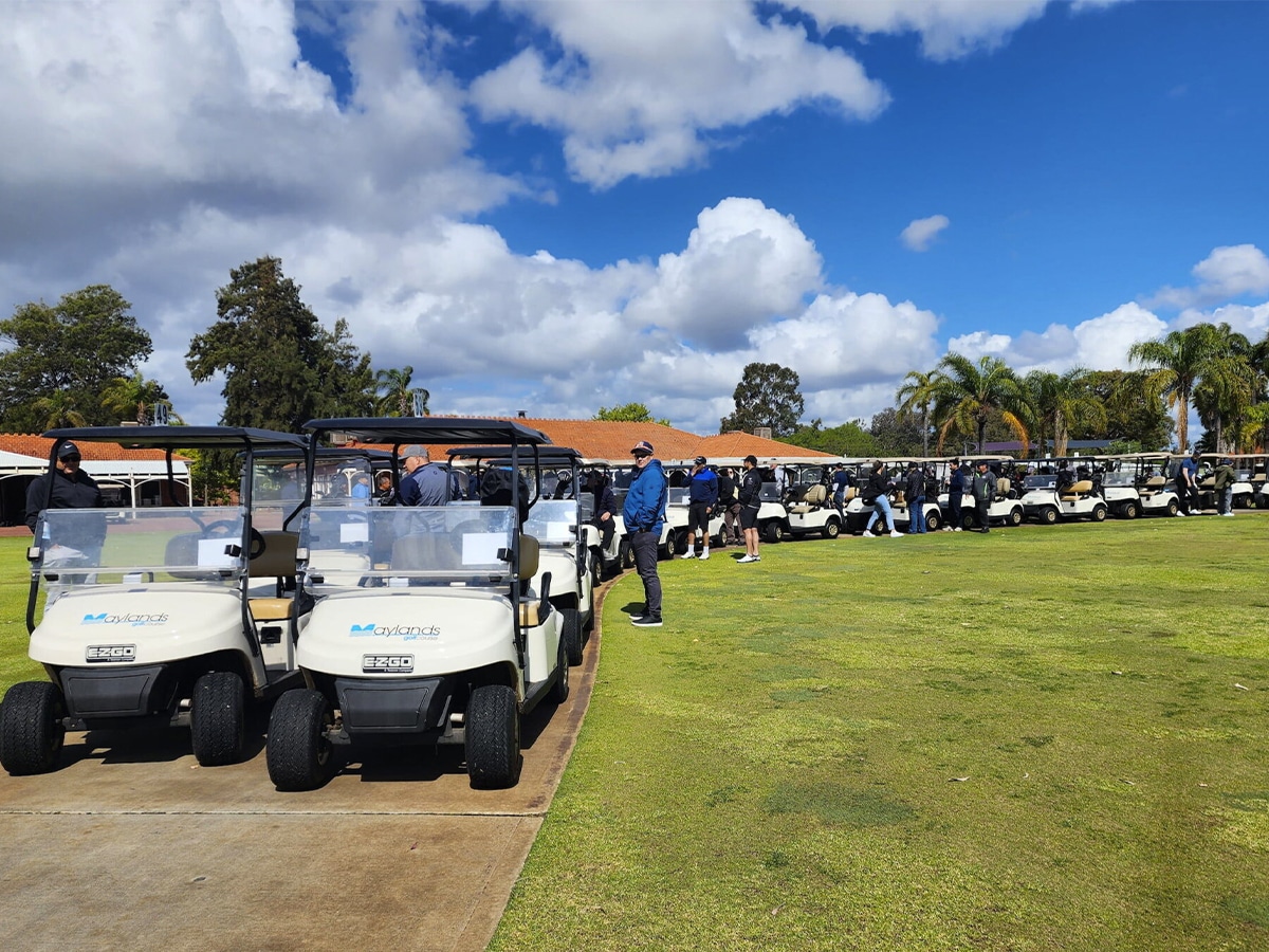 Full shot of golf carts lining up in two columns at the Maylands Peninsula Golf Course