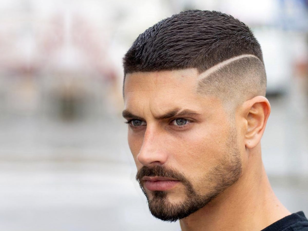 Close up side view of a man with Textured Crop Buzz