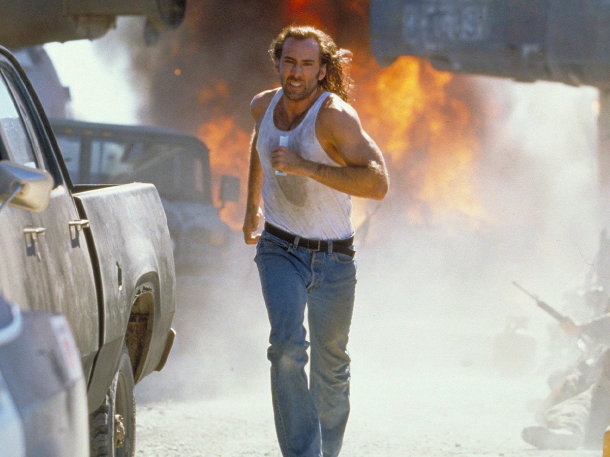 Nicolas Cage running away from an explosion