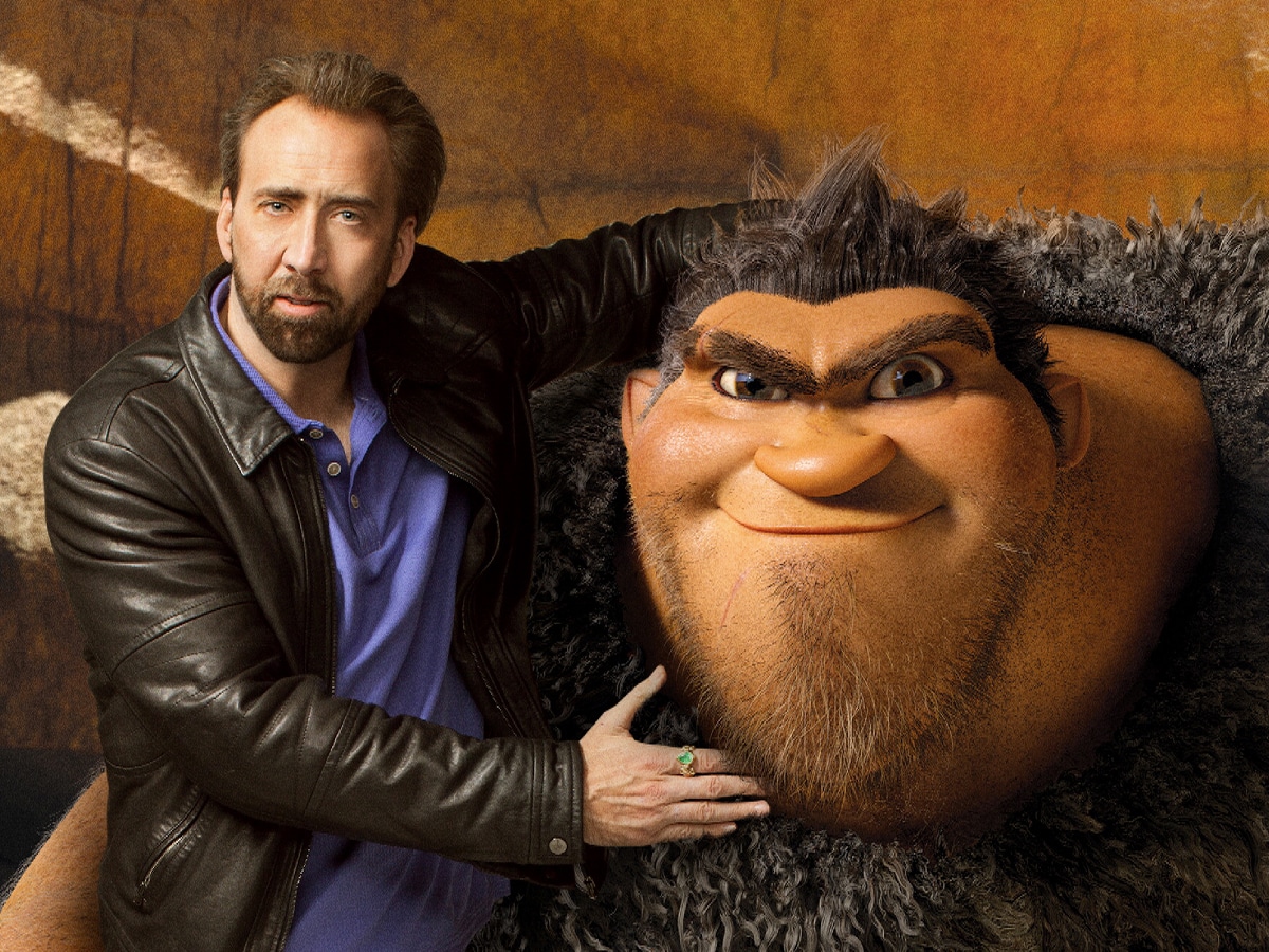 Edited image of Nicolas Cage with his arms around the character Grug from the animated movie The Croods