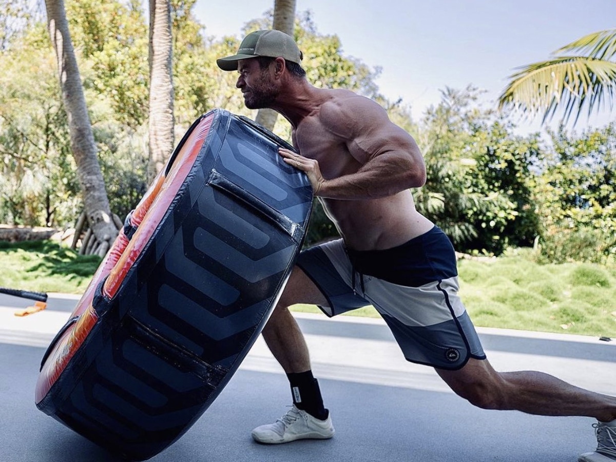 Chris Hemsworth flipping a tire