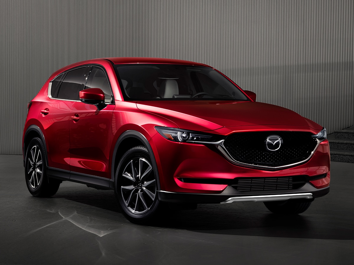 Red Mazda CX-5 Grand Touring AWD SUV on the road