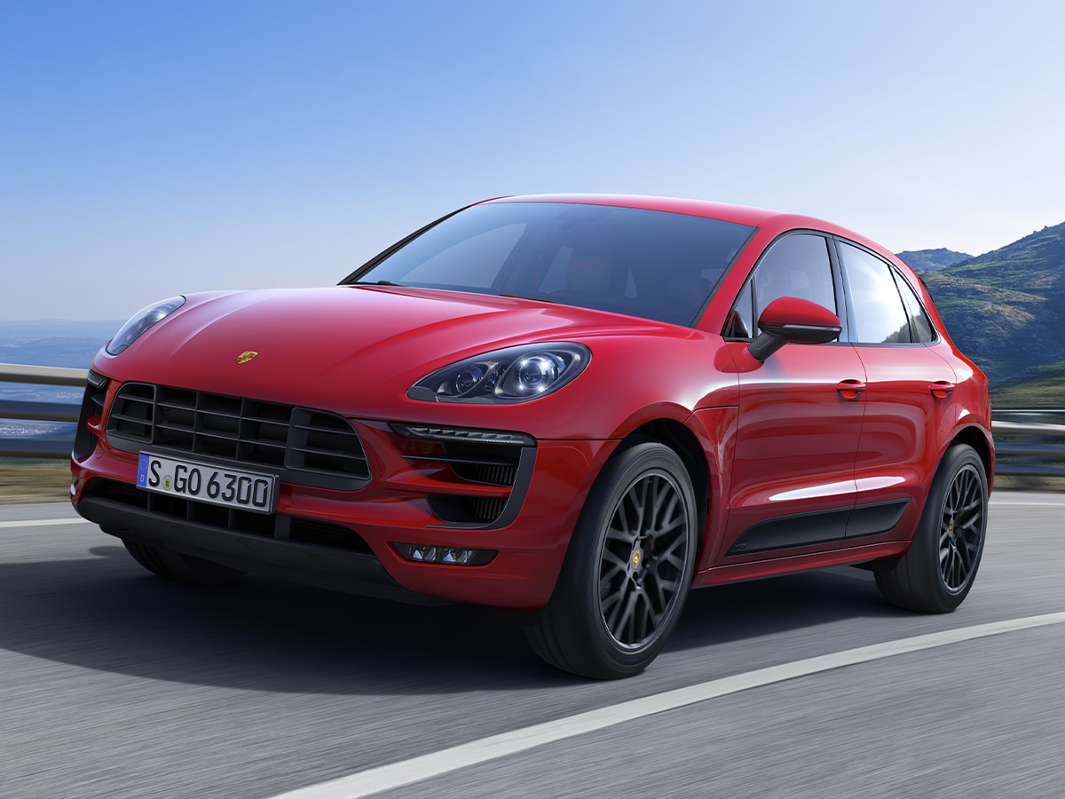 Red Porsche Macan SUV on the road