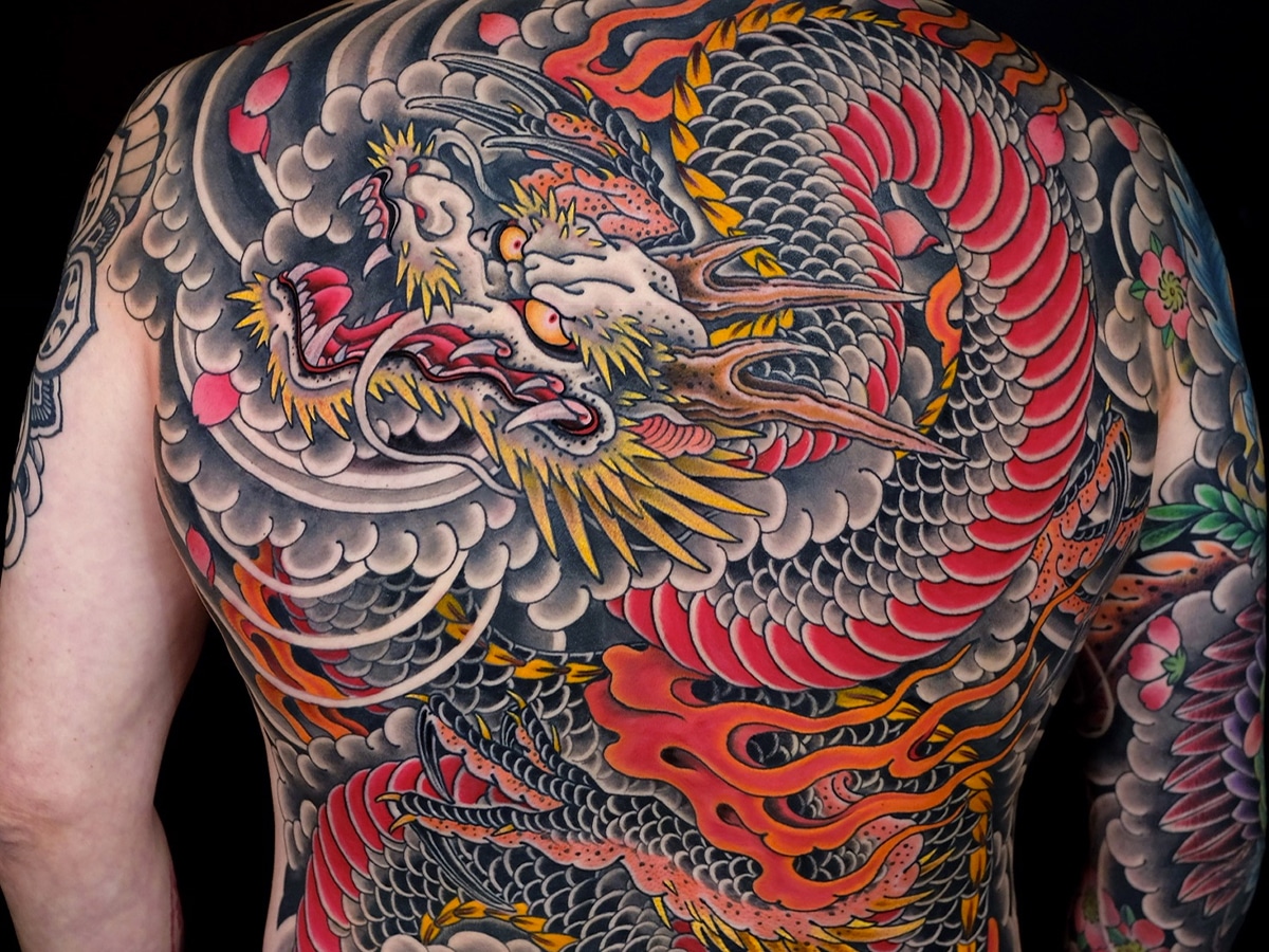 Big coloured tattoo of a dragon on a man's back