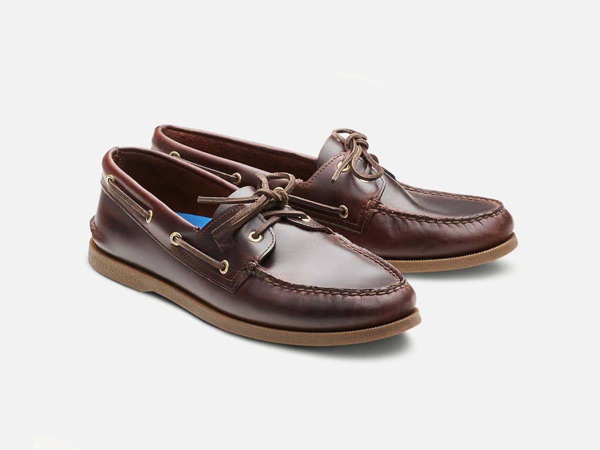 Red brown boat loafers with plain white background