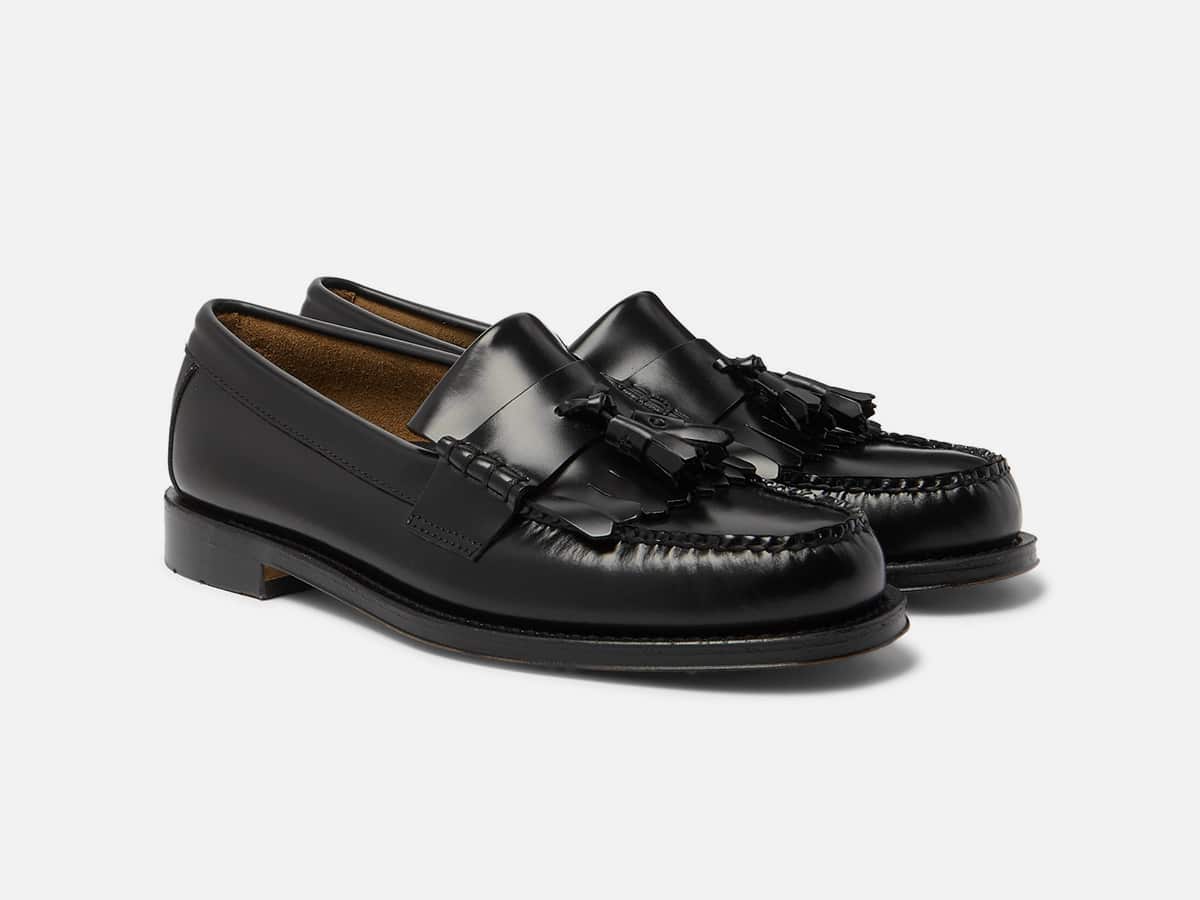 Black Kiltie loafers with plain white background