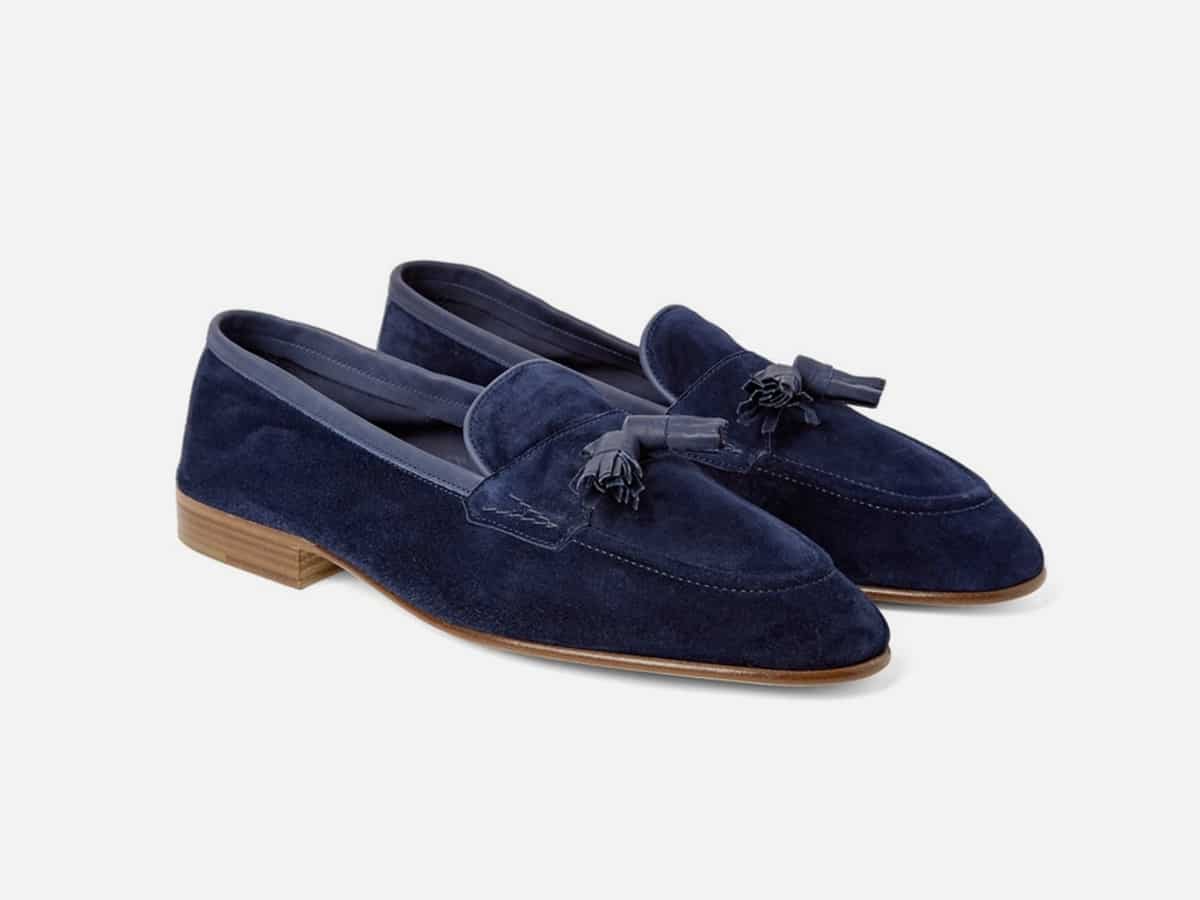 Blue tassel loafers with plain white background