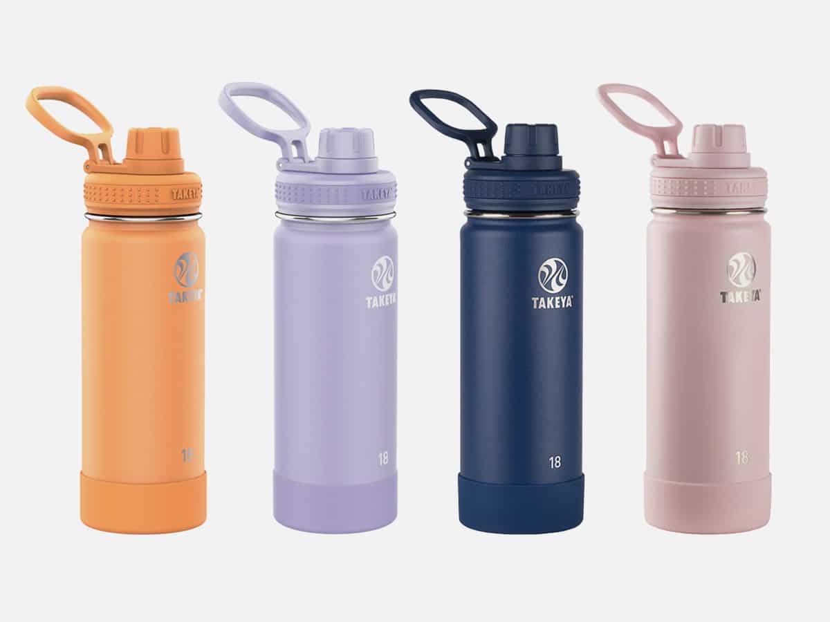 Product image of Takeya Actives Insulated Steel Bottle in Tart Orange, Lavender Field, Midnight, and Blush color variants against plain white background