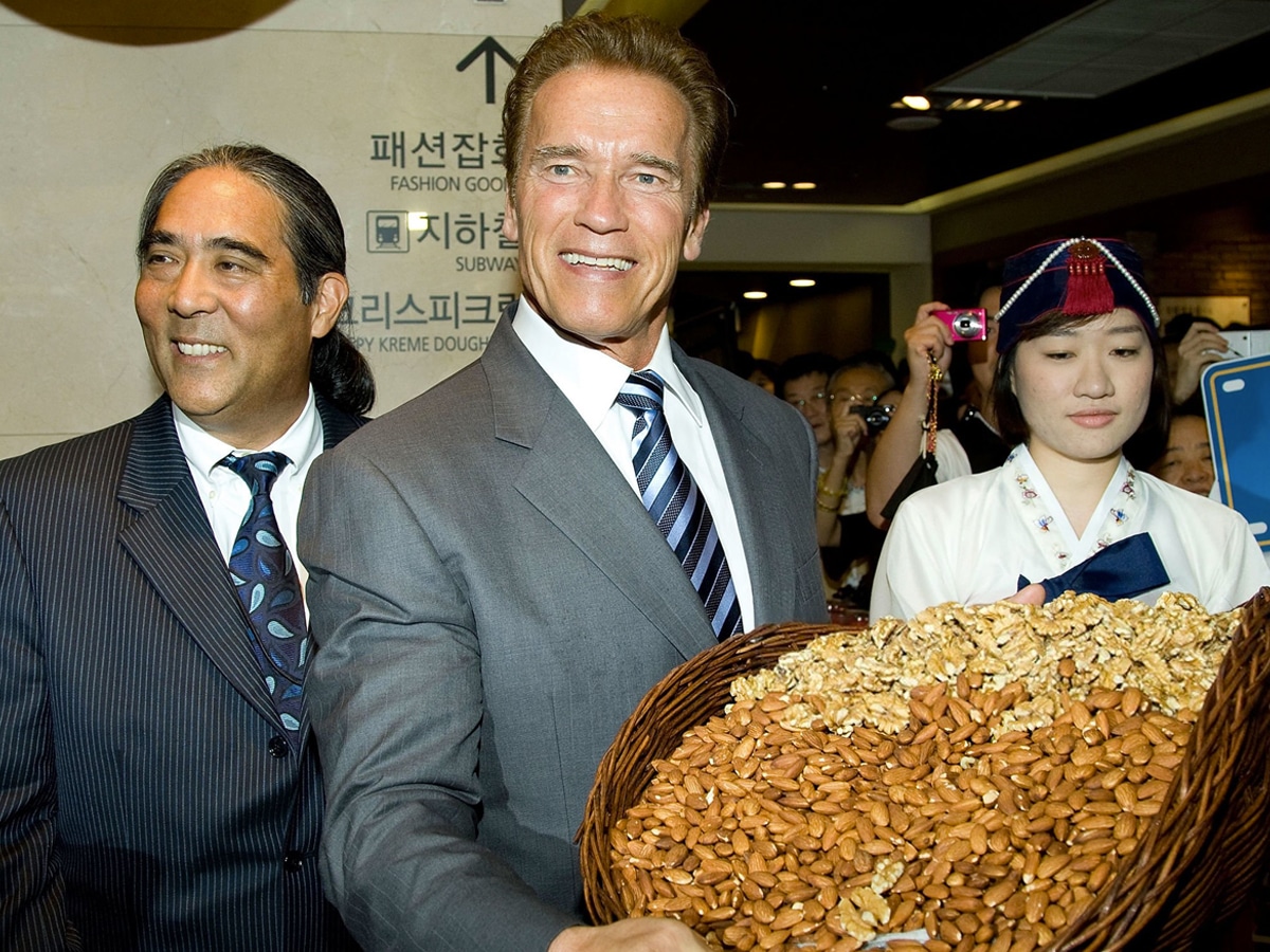 Governor Arnold Schwarzenegger holding basket of grains