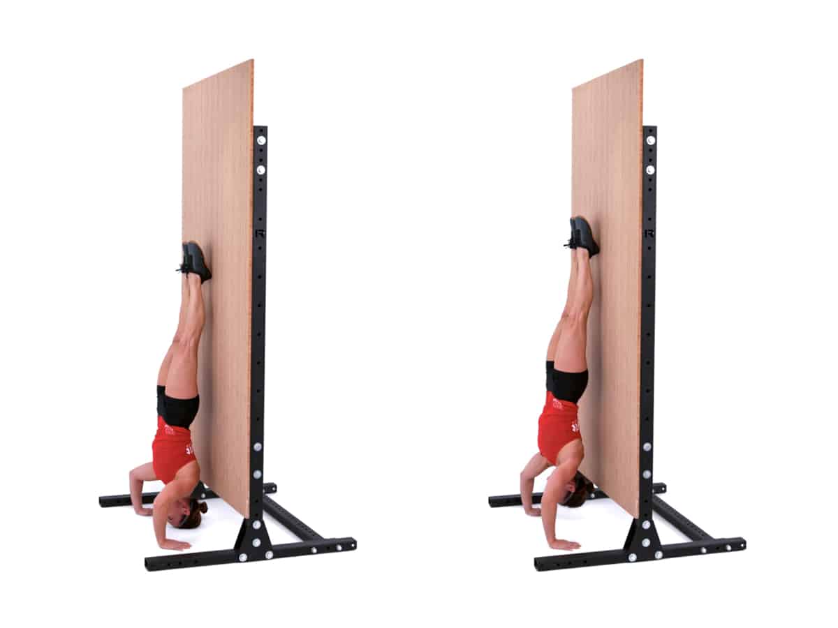 Woman doing handstand press-up exercise