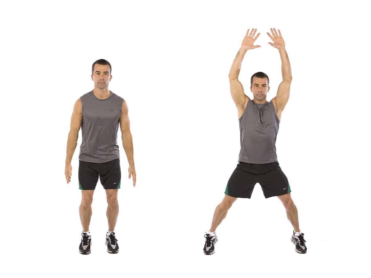 Man doing star jumps exercise