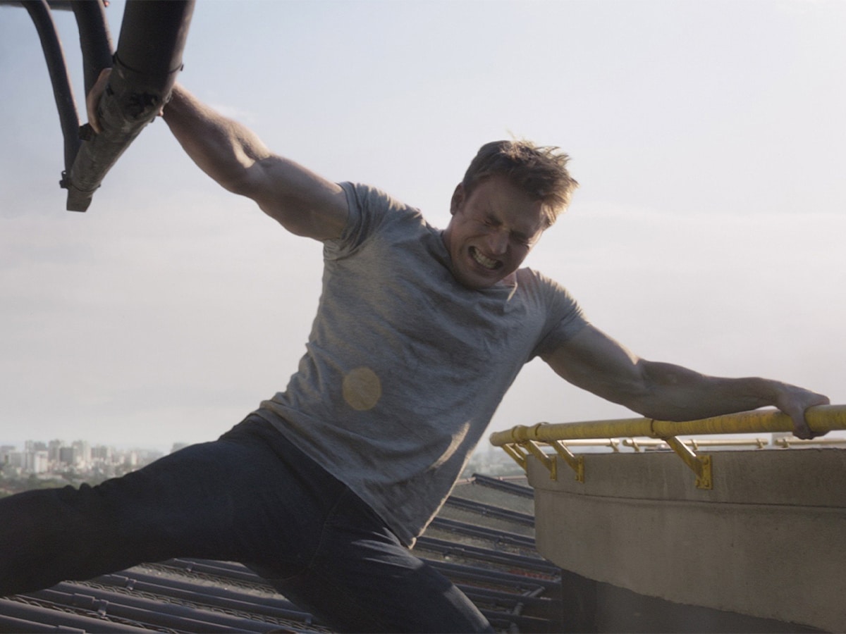 Captain America using his enhanced strength to hold onto a helicopter to prevent it from taking off