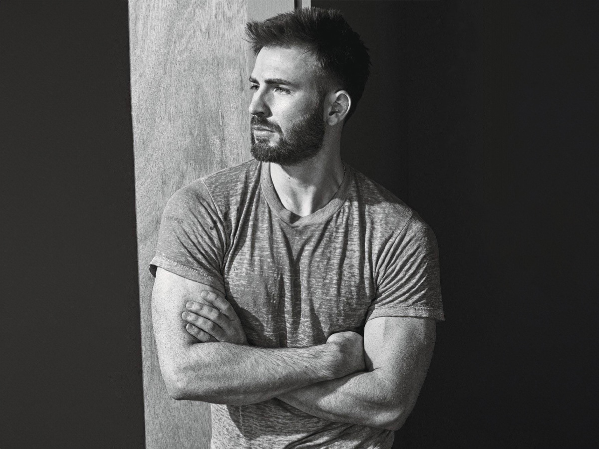 Medium shot of Chris Evans with his arms crossed