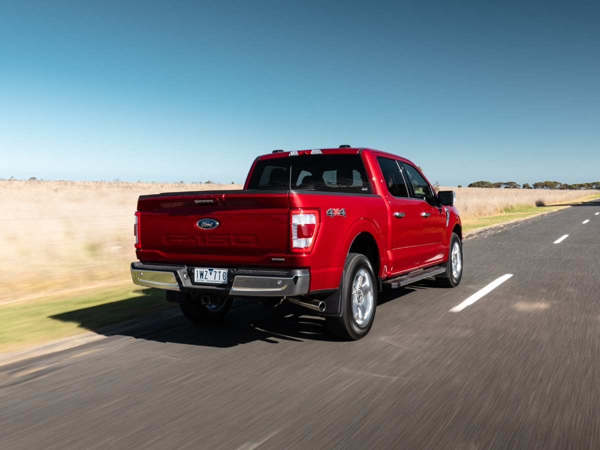 Ford f 150 lariat driving on road rear end
