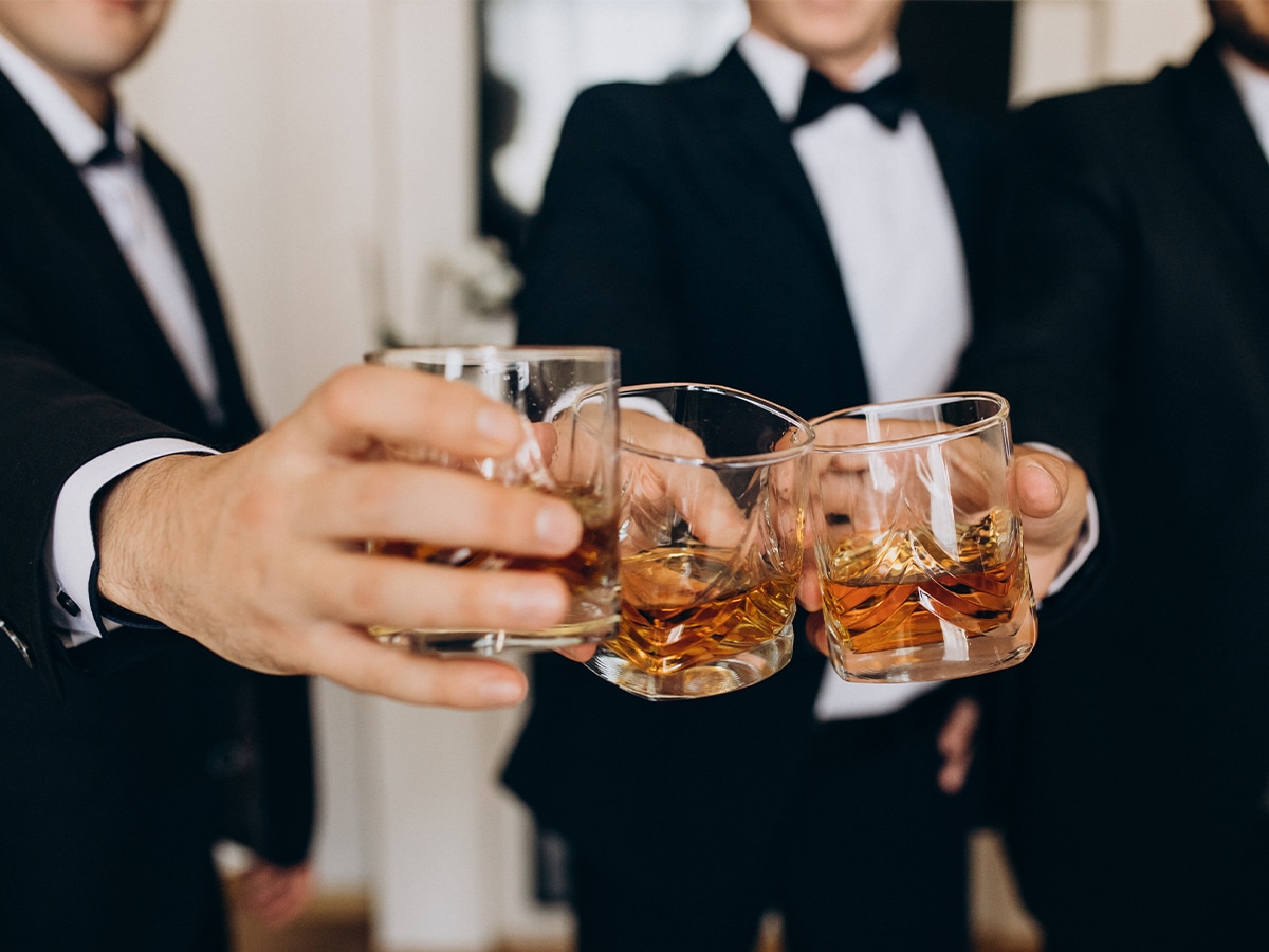 Close-up of a group of businessmen drinking whisky together