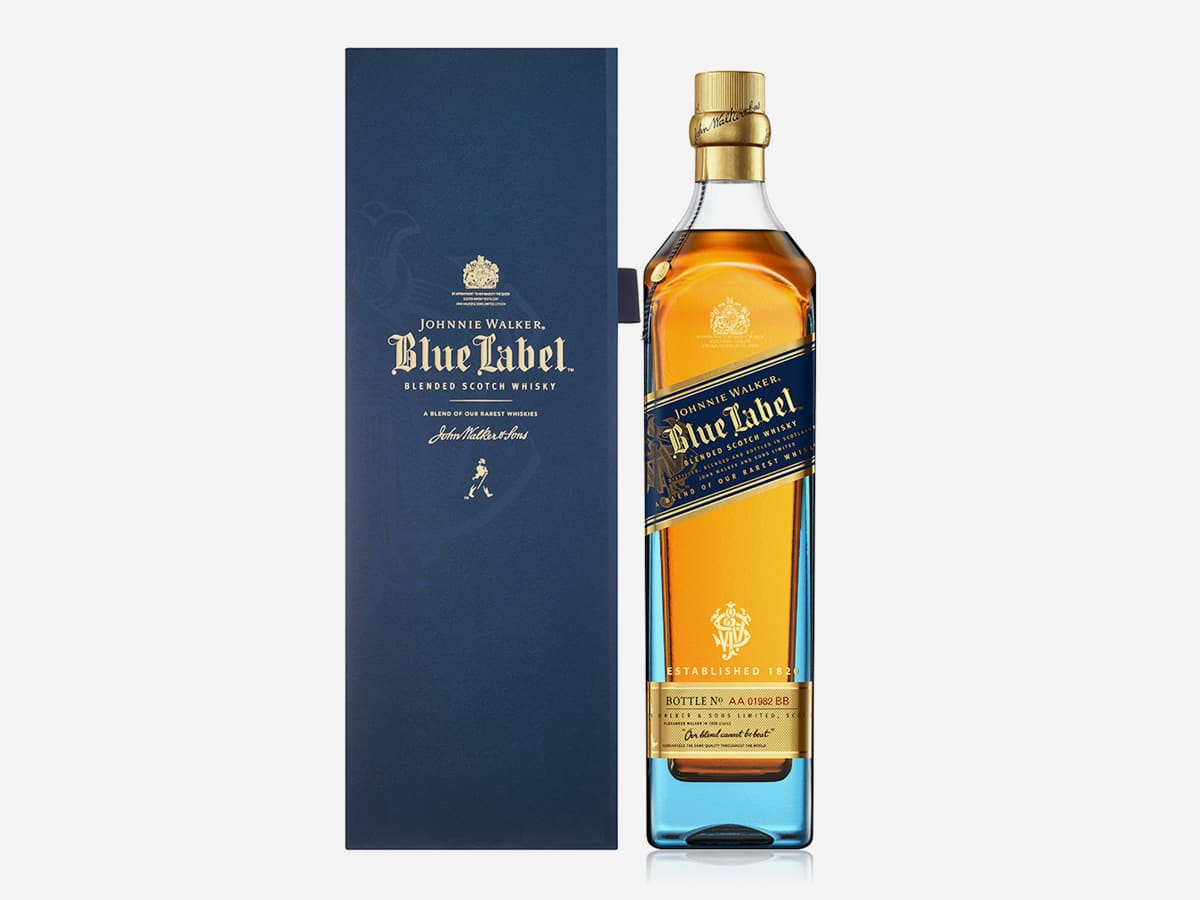 A bottle of premium whisky Johnnie Walker Blue Label and its box packaging displayed against a clean white background