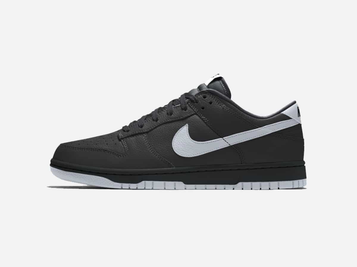 Product image of The Black Album Nike Dunk Low sneakers with plain white background