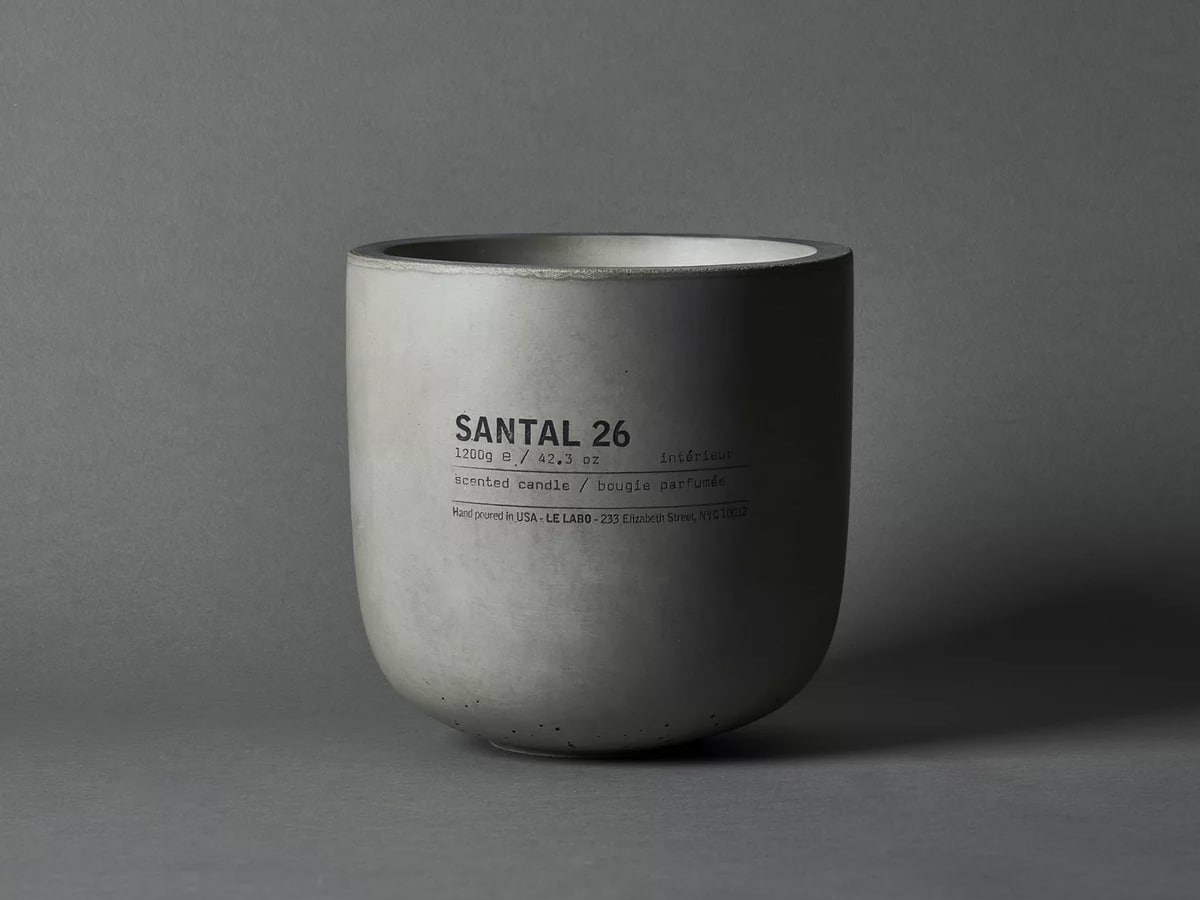 Product image of grey concrete candle with grey background