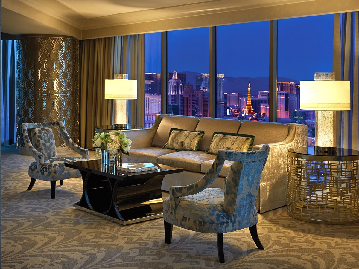 Interior of Four Seasons Hotel Las Vegas lounge with expansive windows showing cityscape at night