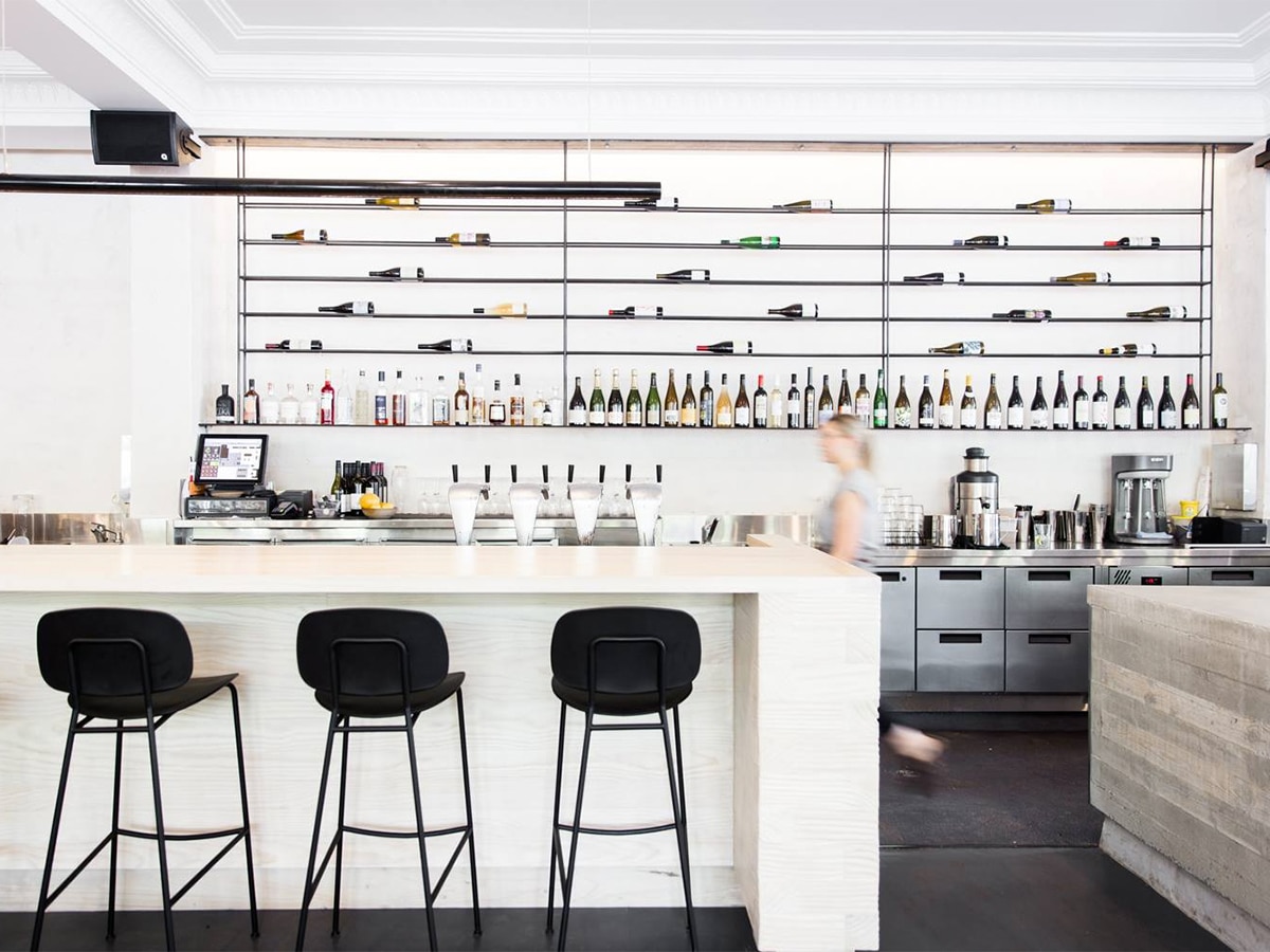 Black and white theme interior of Highroad cafe with coffee bar with black stools