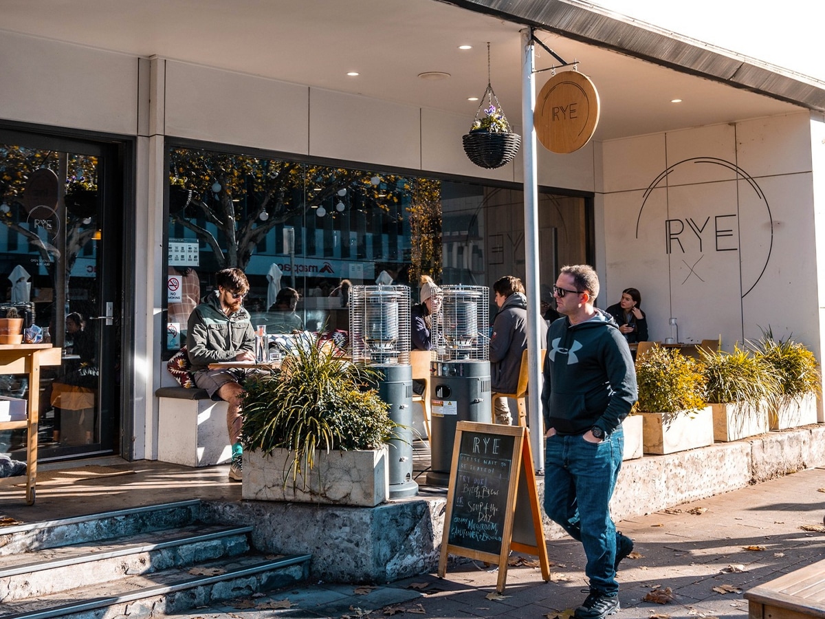 Exterior view of RYE Cafe with customers outdoor