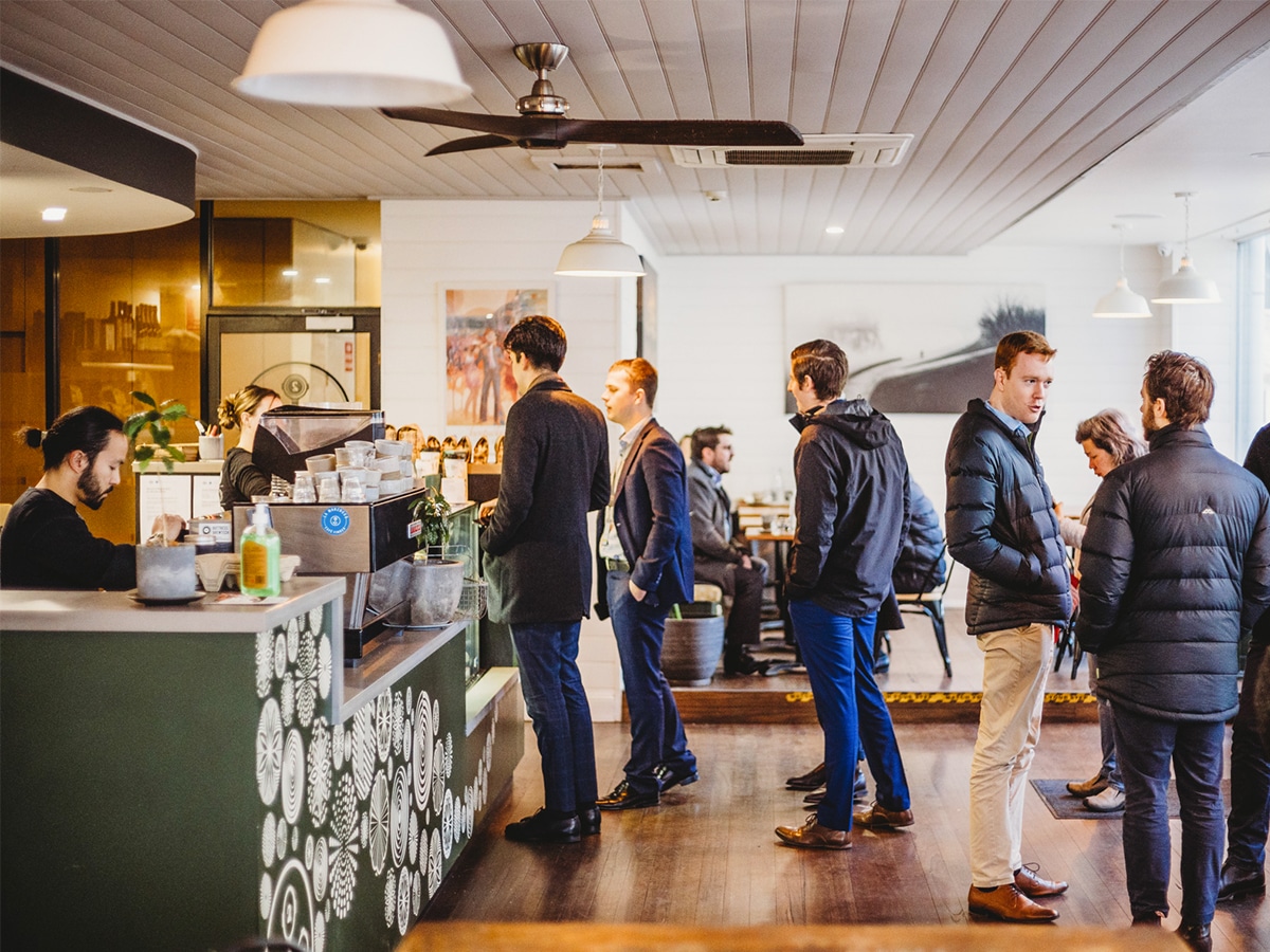 Customers lined up at the service counter of Two Before Ten Hobart Place cafe