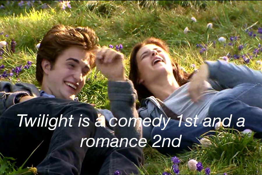 Couple Edward and Bella lying on the grass laughing with the text 'Twilight is a comedy 1st and a romance 2nd'