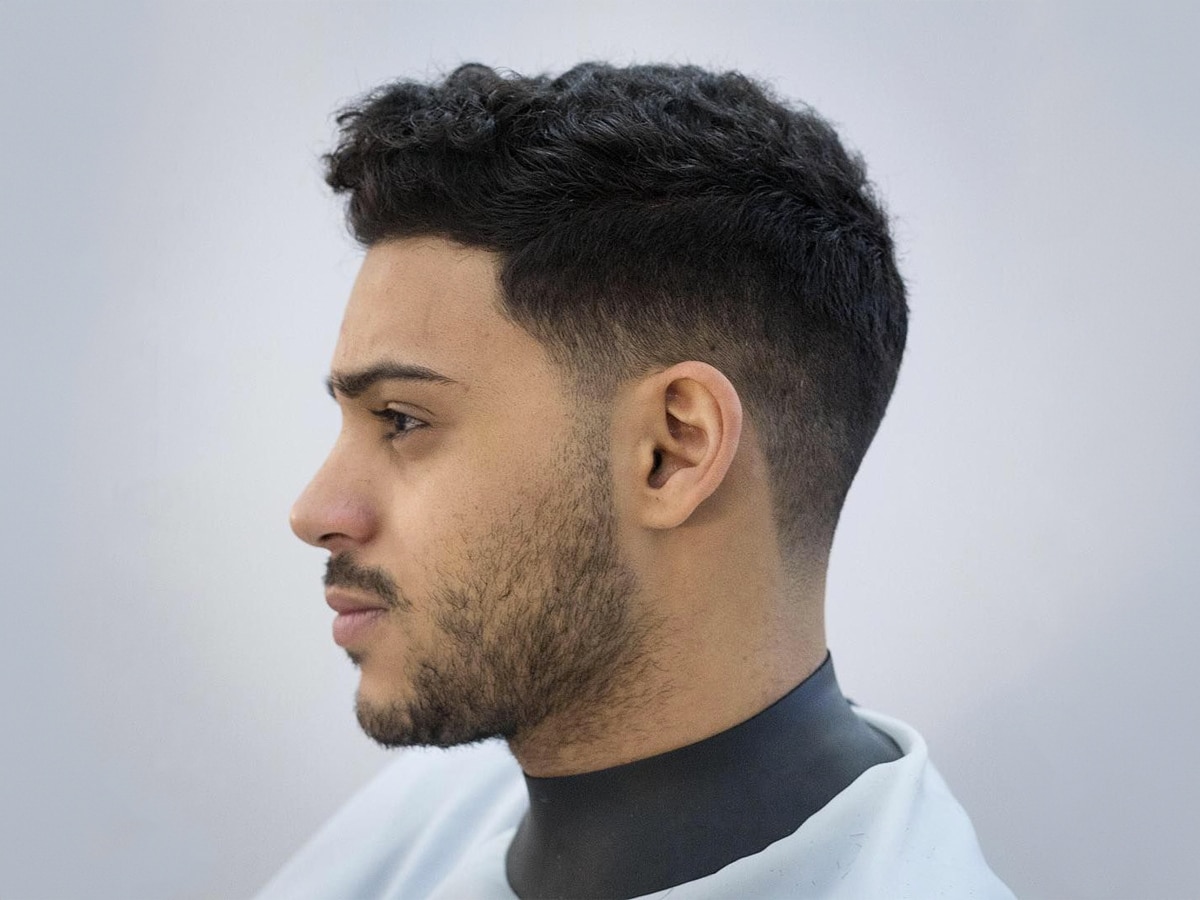 Close up of man with Drop Fade with Tapered Neckline haircut