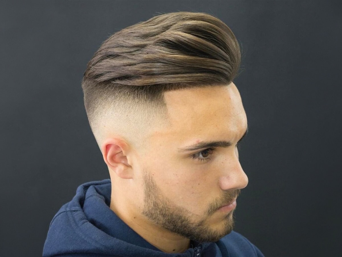 Close up of man with High Fade Textured Comb Over hairstyle