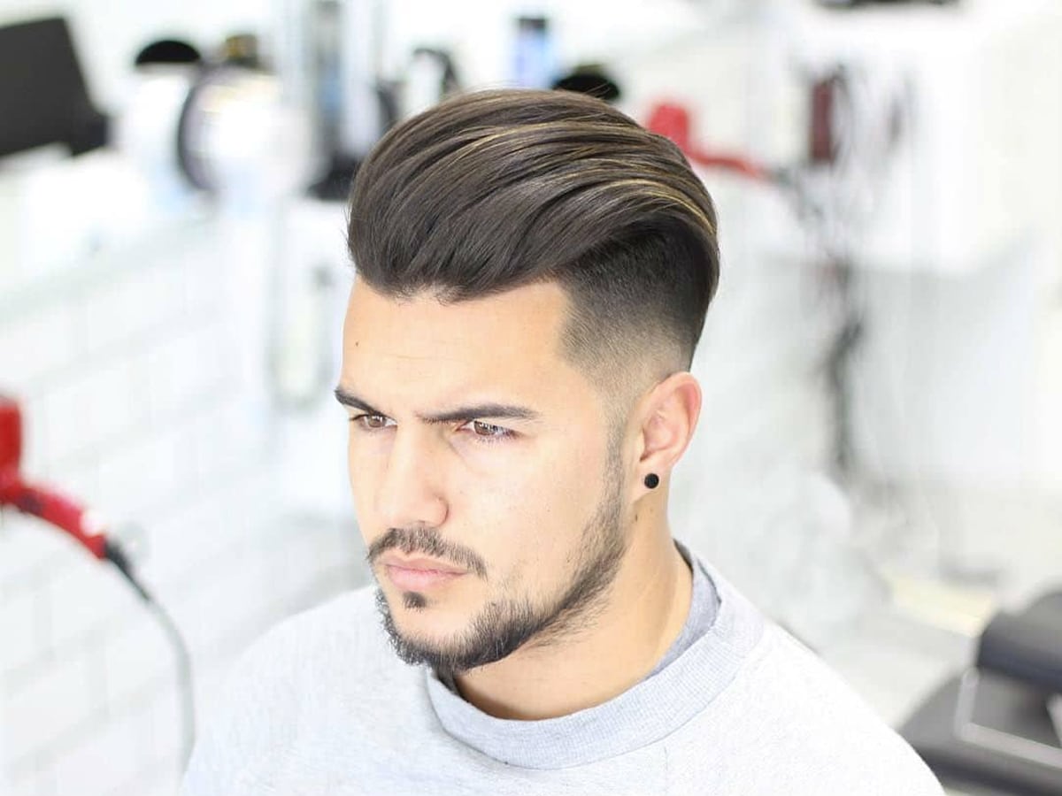Close up of man with pompadour hairstyle