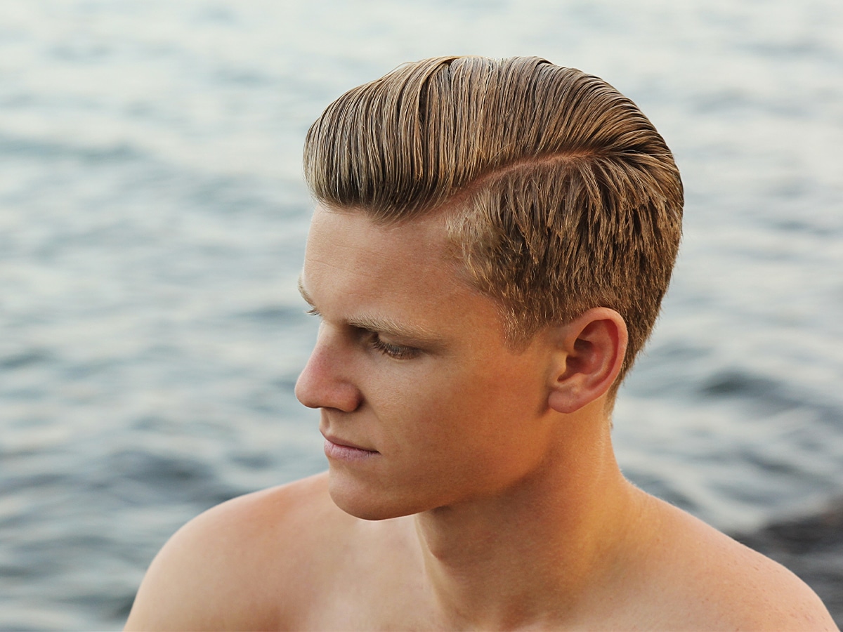 Close up of man with Side Part Slick Back hairstyle