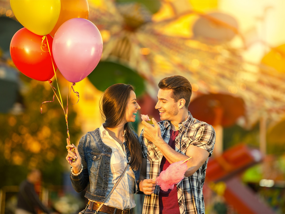 Couple having fun at an amusement park