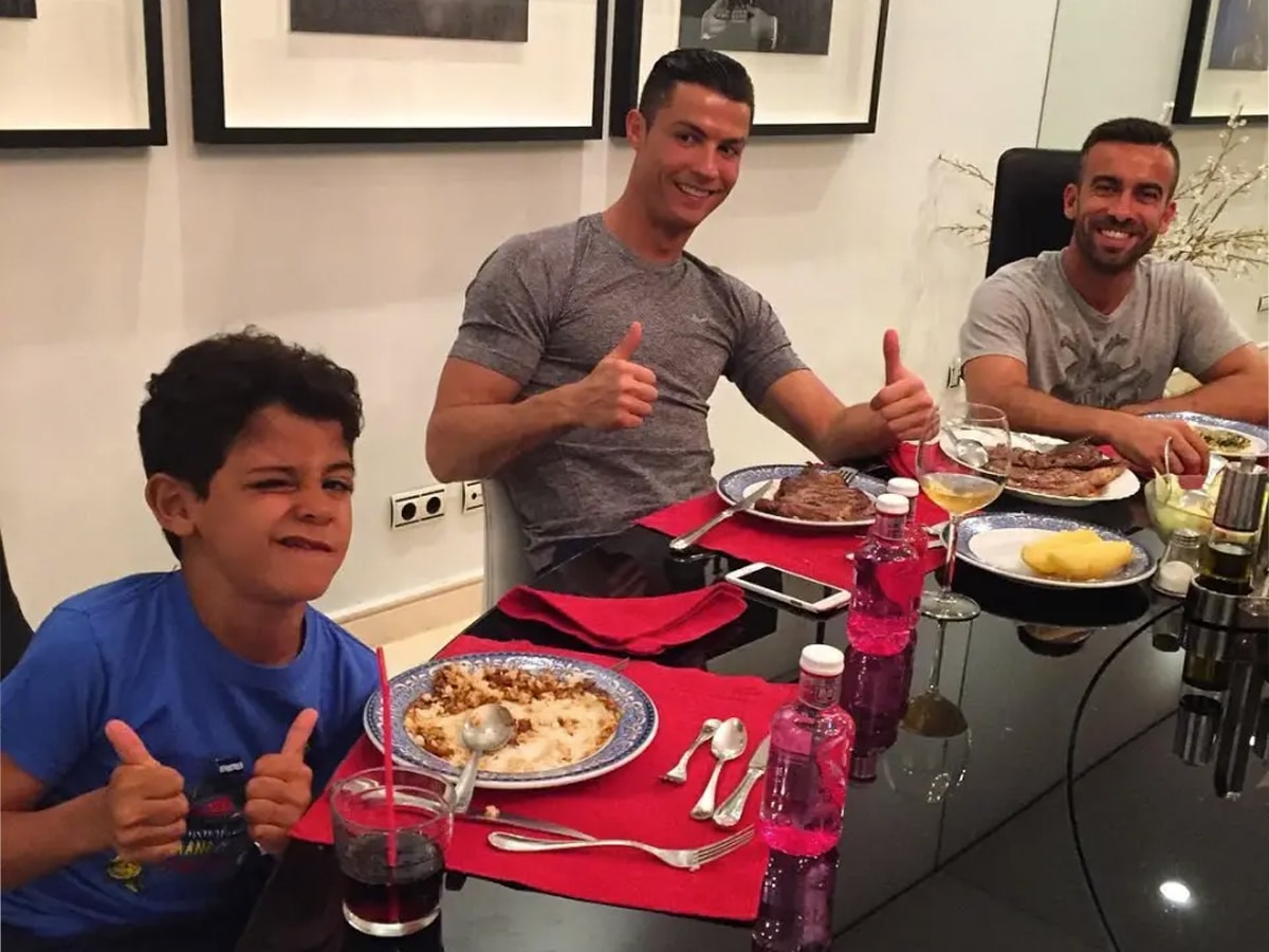 Cristiano Ronaldo enjoys a meal with son and Ricky Regufe