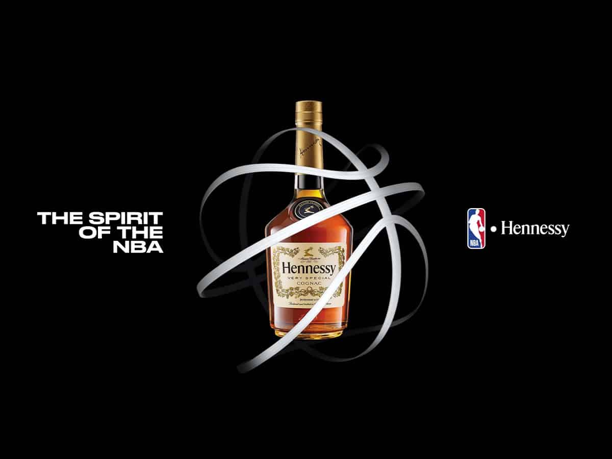 Hennessy V.S bottle inside basketball-shaped white lines with the text ‘THE SPIRIT OF THE NBA’ and the NBA and Hennessy logos