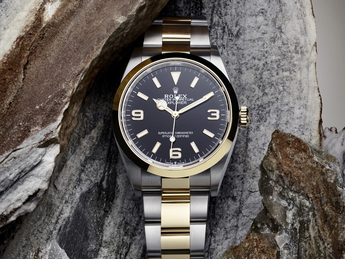 Rolex Explorer oystersteel and yellow gold with marble background