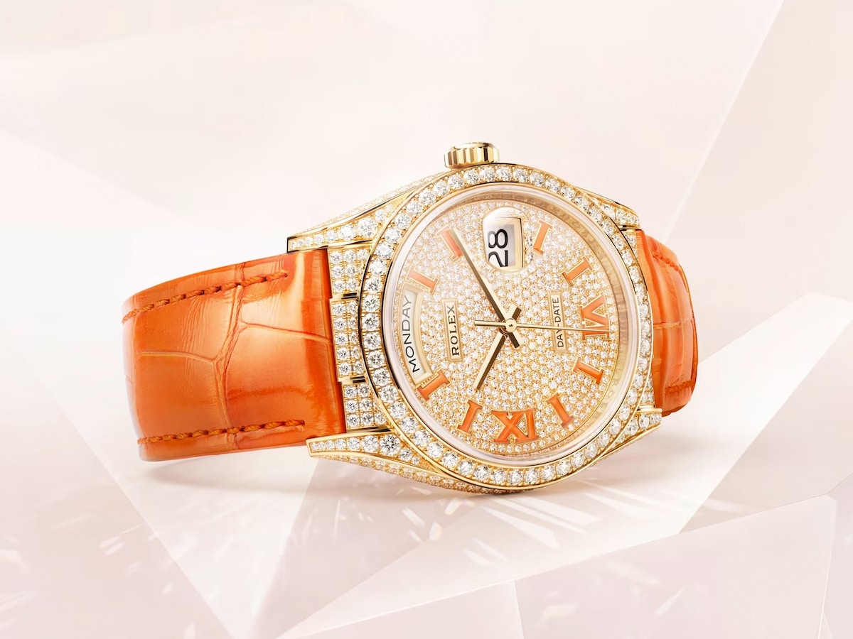 Rolex Day-Date 36 orange with crystal design background