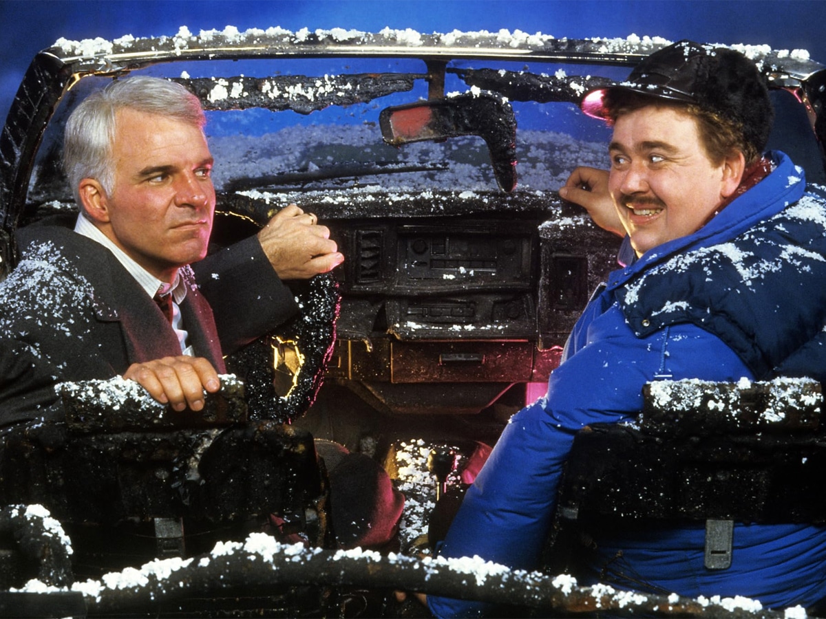 Steve Martin and John Candy looking at each other