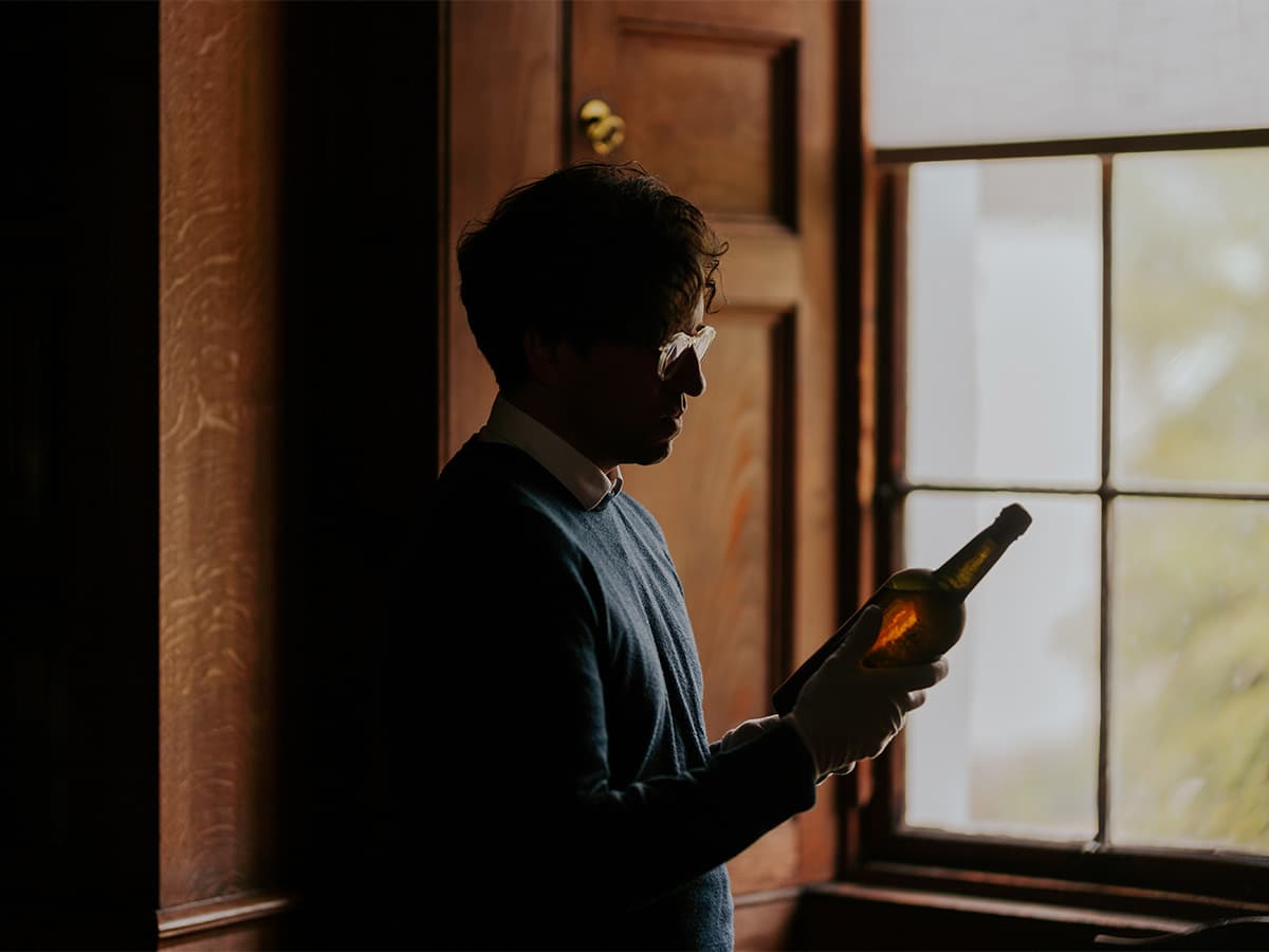 The Whisky Auctioneer Head Curator and Spirits Specialist, Joe Wilson, inspecting the Blair Castle whisky discovery | Image: The Whisky Auctioneer