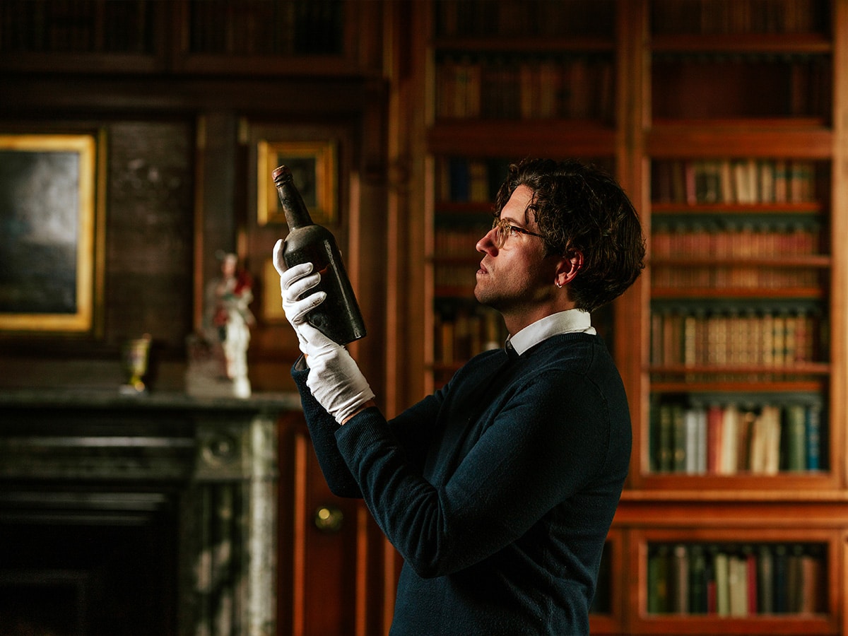 The Whisky Auctioneer Head Curator and Spirits Specialist, Joe Wilson, inspecting the Blair Castle whisky discovery | Image: The Whisky Auctioneer