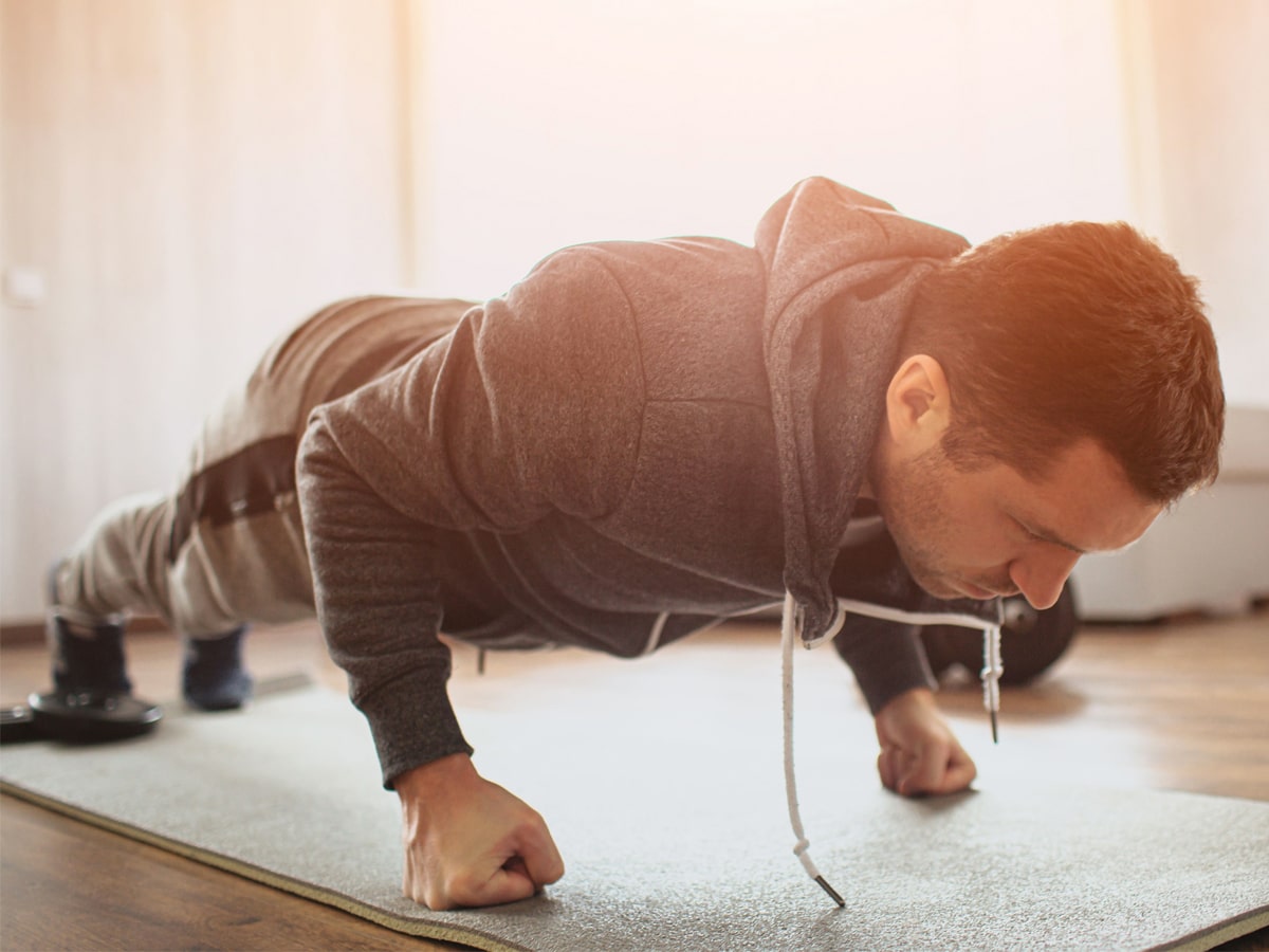 Man doing a fist plank exercise