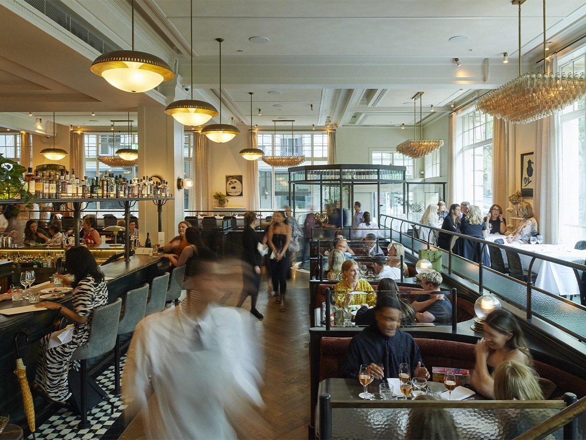 Interior of Gimlet restaurant with customers dining