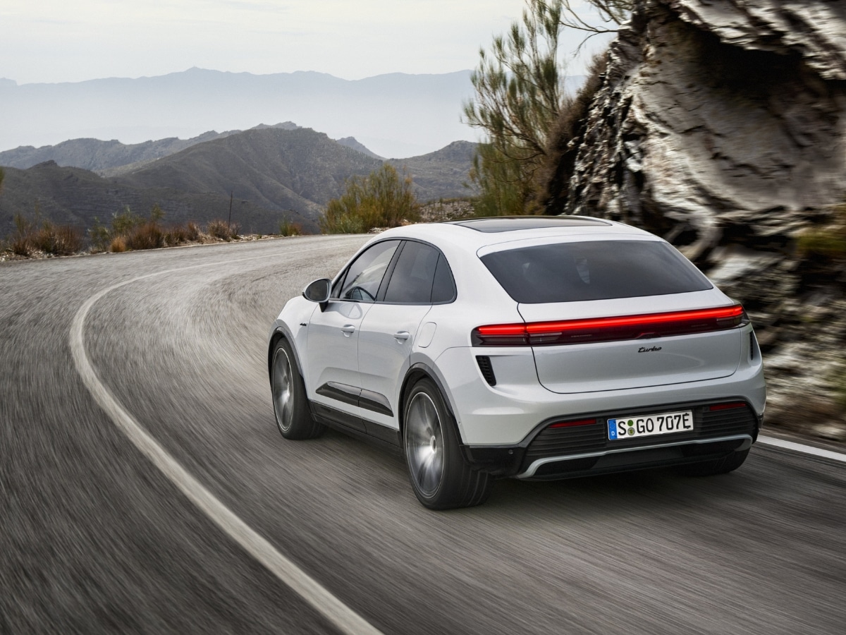 2024 porsche macan turbo from behind on road